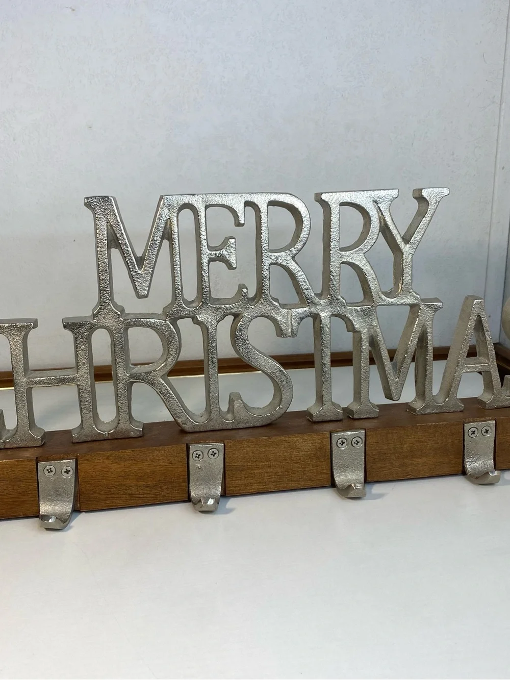 Merry Christmas stocking holder with a wooden stand